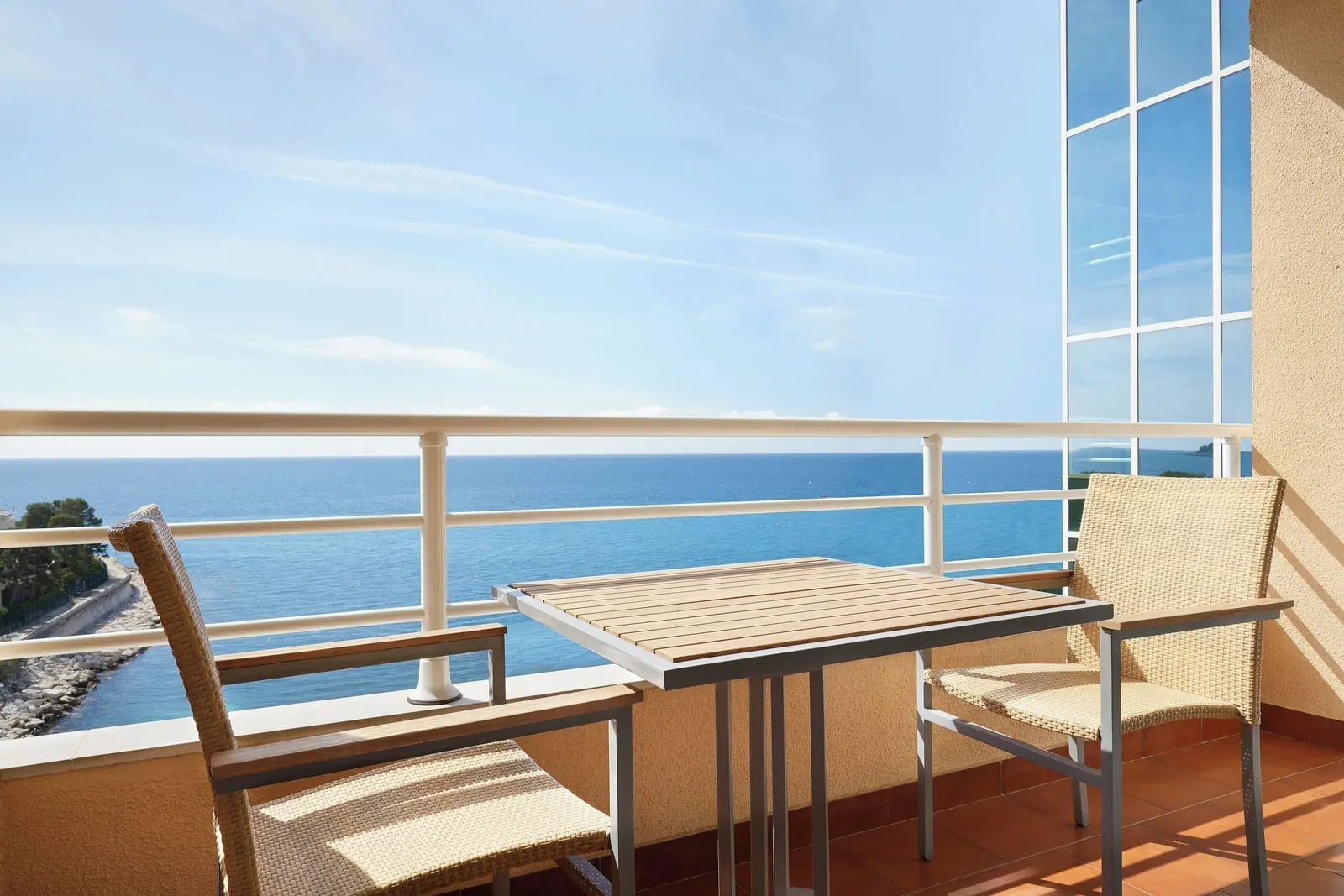 Deluxe sea-view room at Le Méridien Beach Plaza: the balcony table and two chairs facing the sea