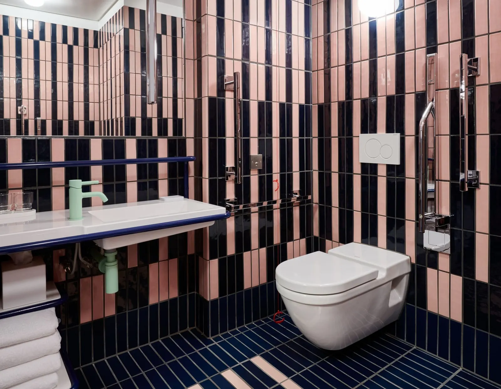 Accessible Standard Double bathroom at The Standard, London: a wall-hung toilet with grab rails and a low basin