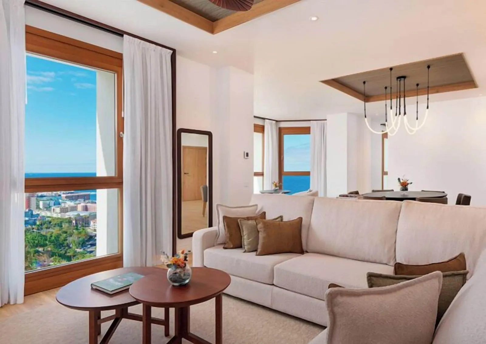 1 Bedroom Grand Suite Ocean View at Gran Hotel Taoro: the living room, a sofa and windows onto the town and sea