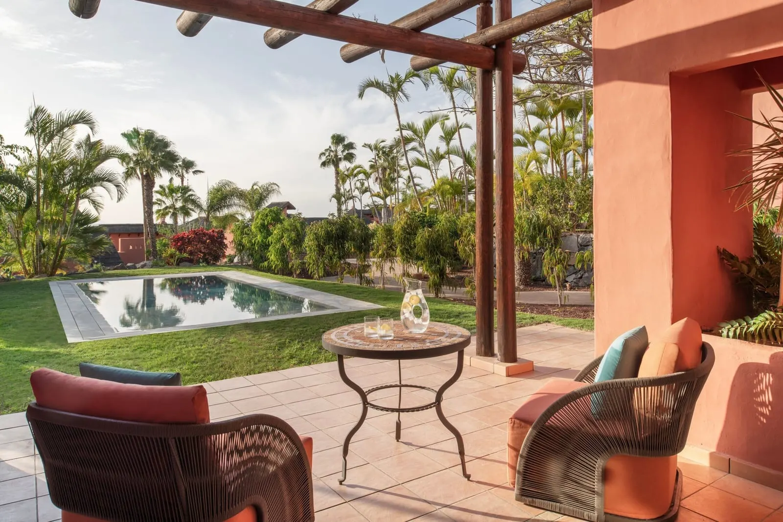 Retreat Two Bedroom Suite with Private Pool at the Ritz-Carlton Abama: terrace chairs under a pergola, the pool beyond