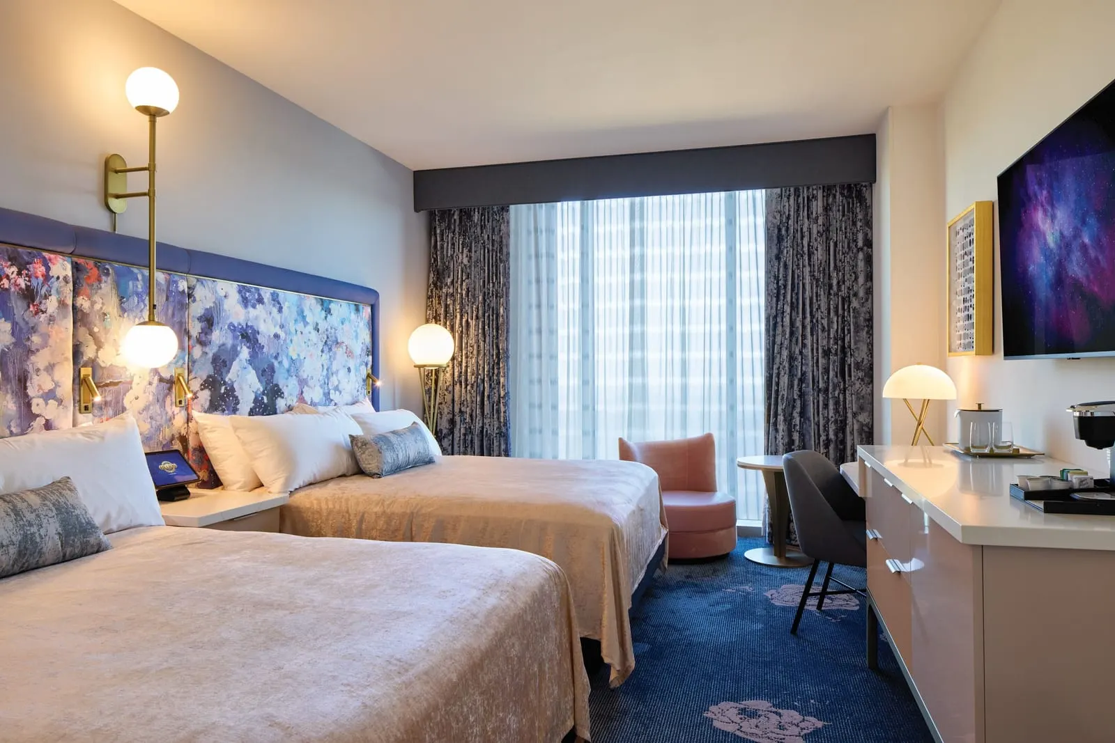 Universal Helios Grand Hotel, a Loews Hotel: A two-queen room with its flowered headboard