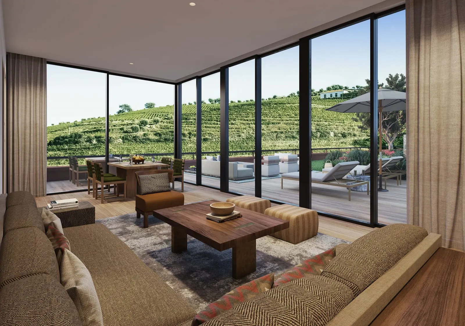 Vineyard Garden Suite at Six Senses Douro Valley: a sofa inside glass walls, with a furnished terrace and vineyards beyond