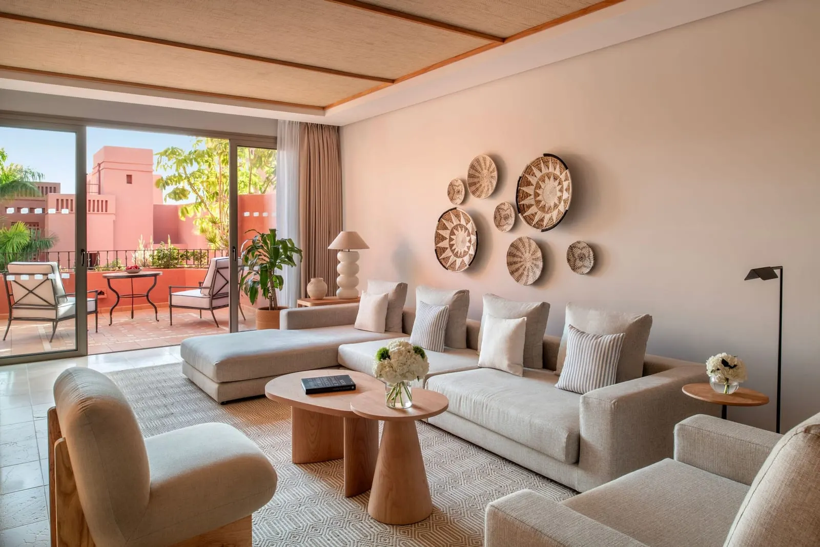One Bedroom Suite, Resort View at the Ritz-Carlton Abama: the living room, with a corner sofa and doors to the terrace