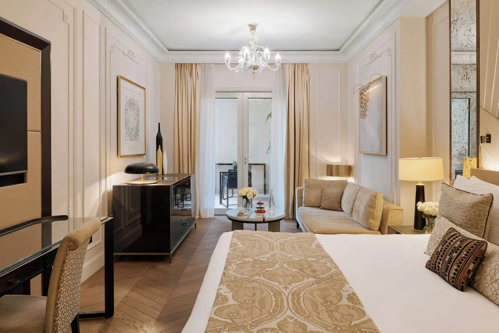 Superior Room with patio view at Hôtel de Paris Monte-Carlo: the bed, a desk, a sofa and French windows at the far end