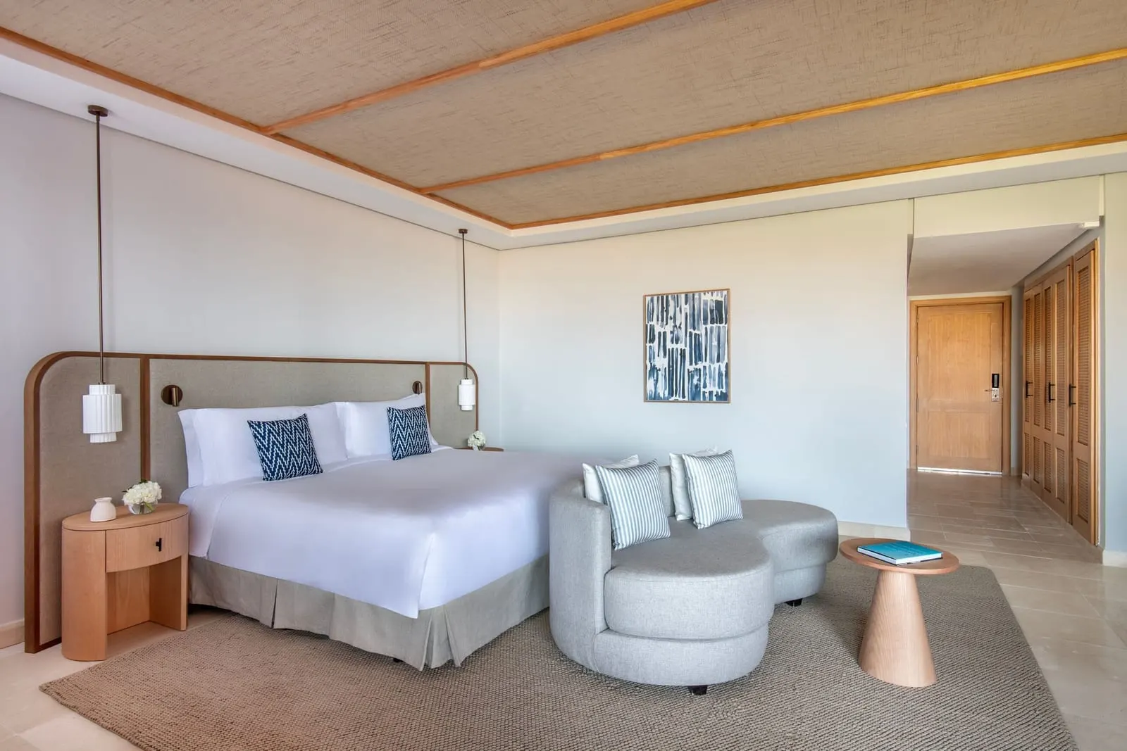 Deluxe Room, Resort View, with Shower Only at the Ritz-Carlton Abama: a king bed and a round armchair