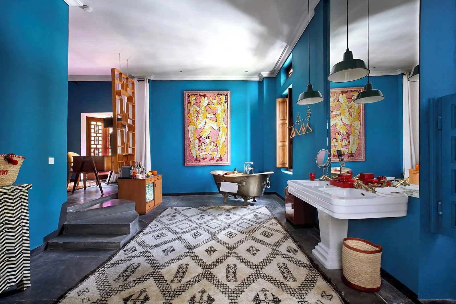 Three Bedroom Family Suite at El Fenn: a blue room with a roll-top bath, a large basin and a patterned tiled floor