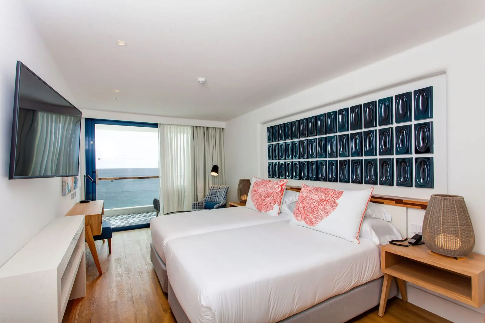 Double Superior Sea View at Hotel Fariones: two single beds made up as one, a dark tiled feature wall and a glass door to the terrace