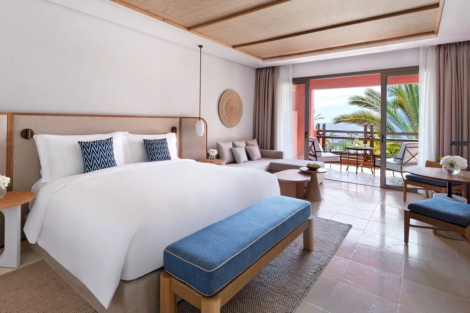 Deluxe Room, Resort View at the Ritz-Carlton Abama: a king bed, a blue bench and a sofa by the balcony doors