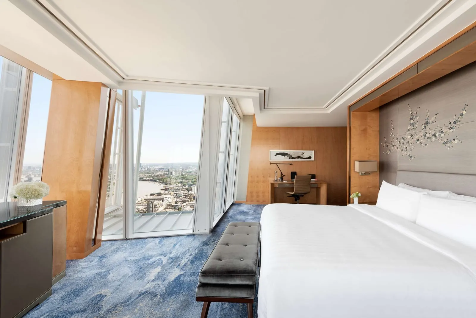 Iconic City View Room at Shangri-La The Shard: the bed, a desk and a corner window looking down on the Thames