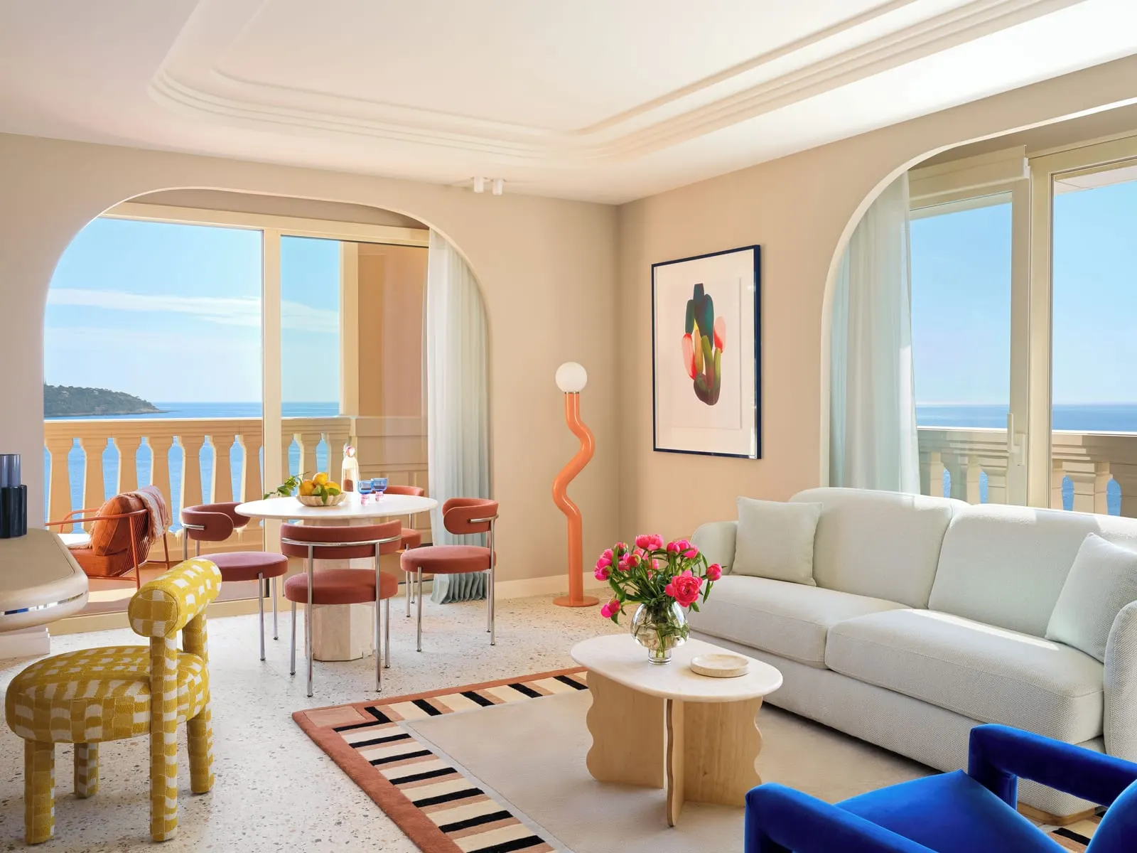 Prestige Duplex Suite with sea view at Monte-Carlo Bay Hotel & Resort: the living room with a sofa, a dining table and windows onto the sea