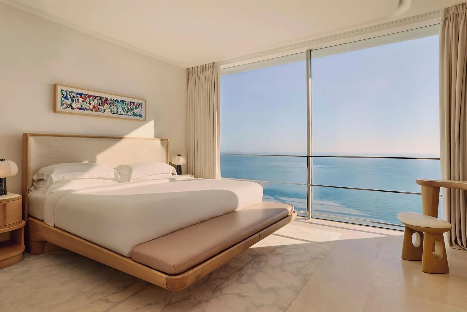 Infinity Pool Duplex Suite at The Maybourne Riviera: the bed facing a wall of glass onto the sea