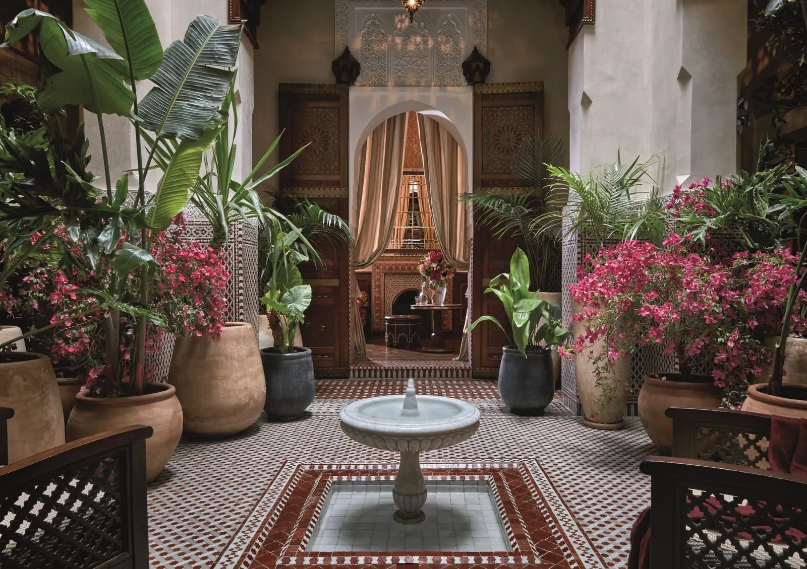 Royal Mansour Marrakech: A tiled patio with a fountain and bougainvillea