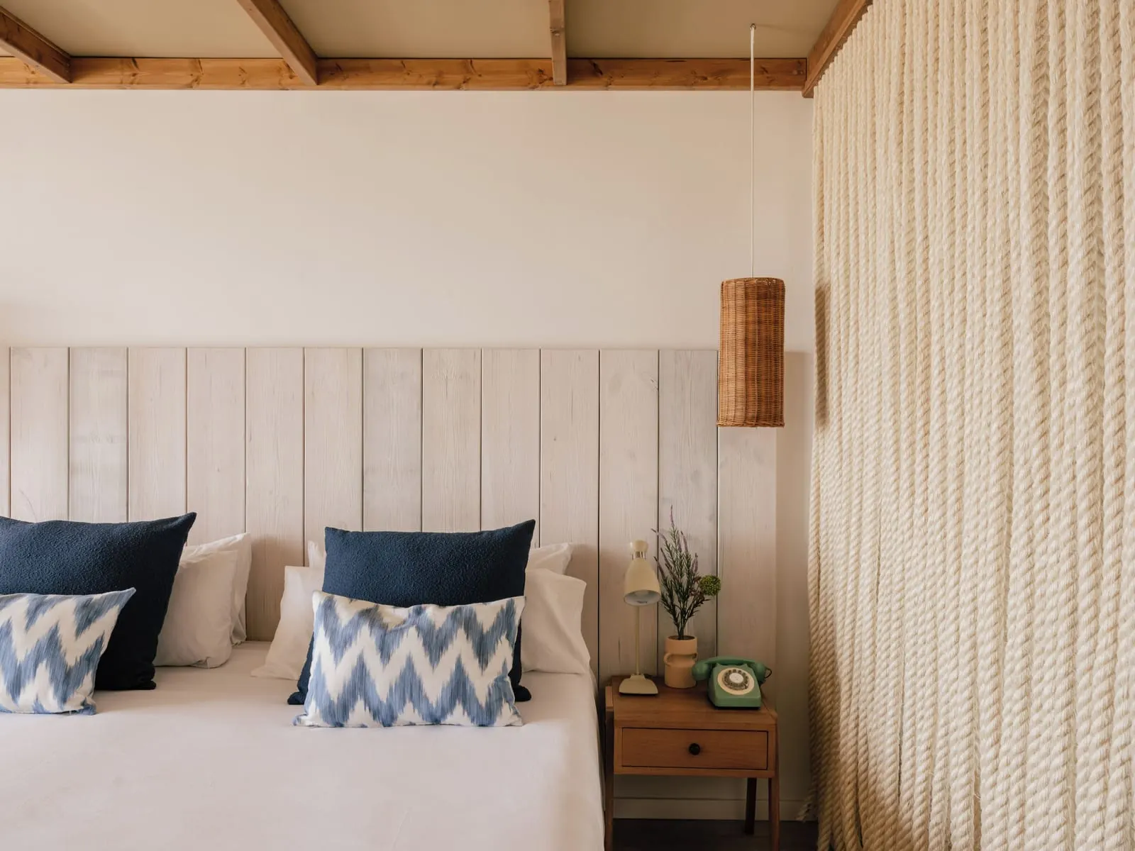 Zel Ocean View at ZEL Fuerteventura: a double bed against a white panelled headboard, with blue patterned cushions and a bedside table