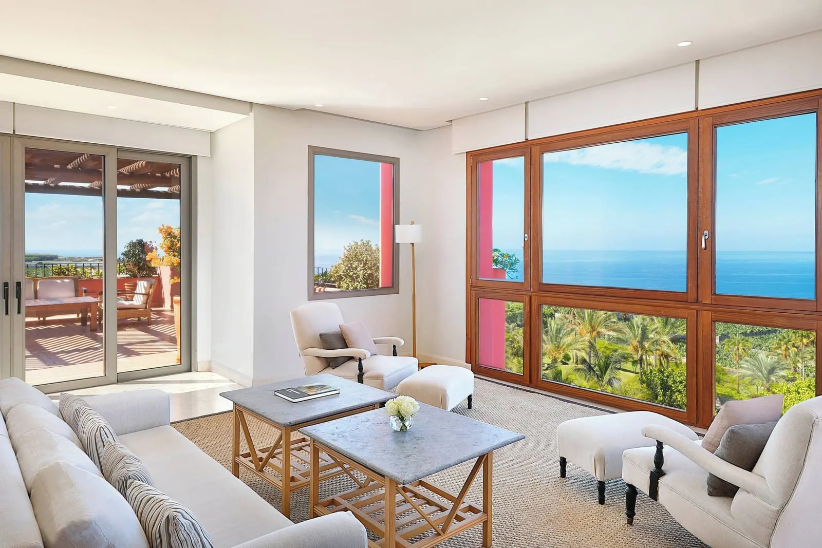 Royal Suite at the Ritz-Carlton Abama: the living room, with sofas and windows onto palms and the sea