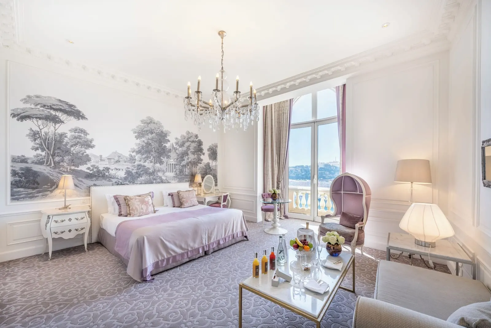 Junior Suite with sea view at Hôtel Hermitage Monte-Carlo: the bed below a landscape mural and a window over the sea