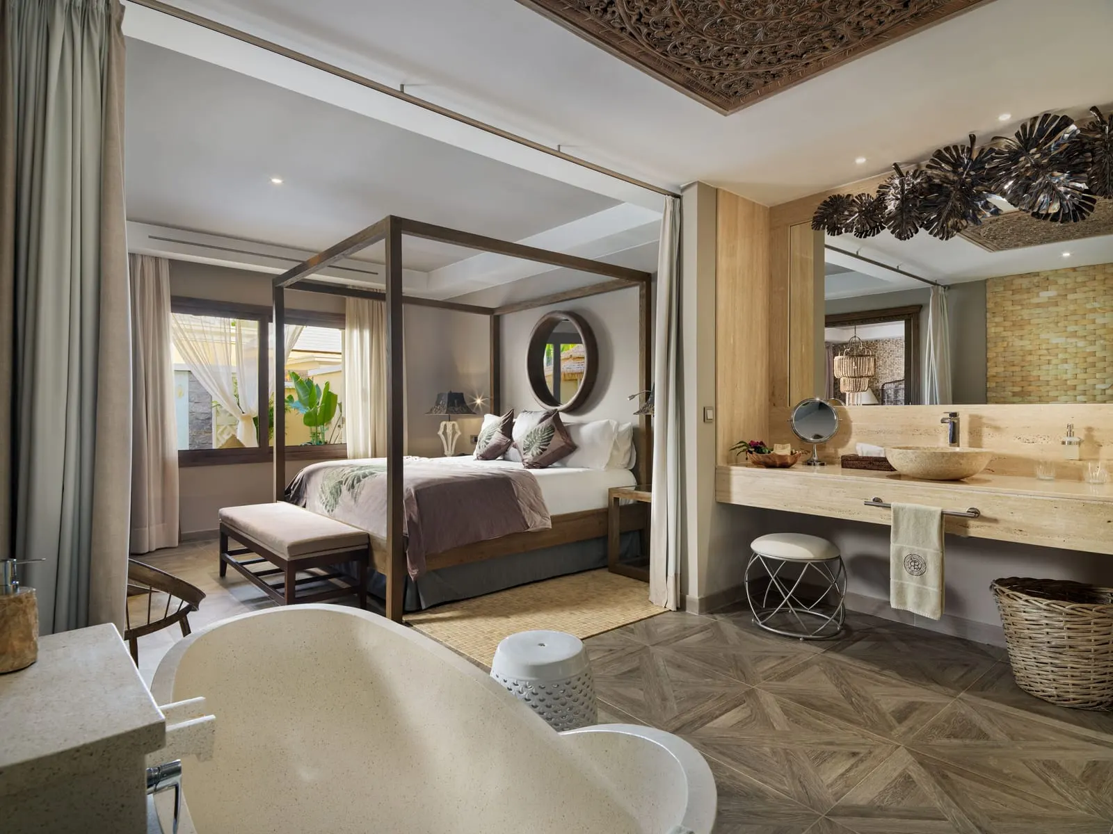 One-bedroom Pool Villa at Royal River: a four-poster bed, a freestanding bath and a stone vanity