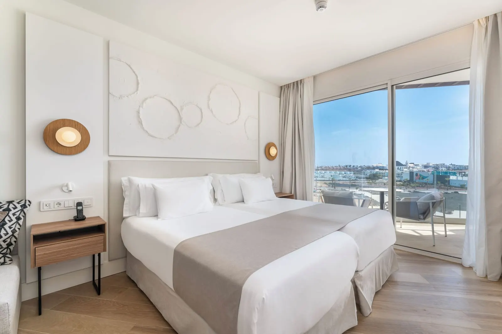 Superior at Barceló Playa Blanca: two beds pushed together beside a sliding glass door to the balcony