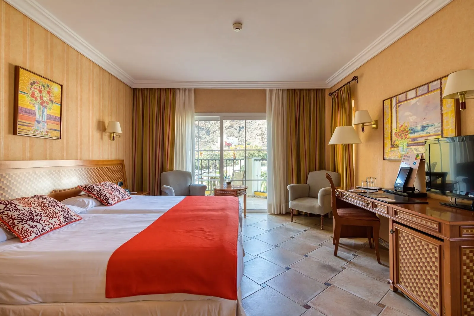 Hotel Cordial Mogán Playa: A Family Room bedroom opening onto its balcony