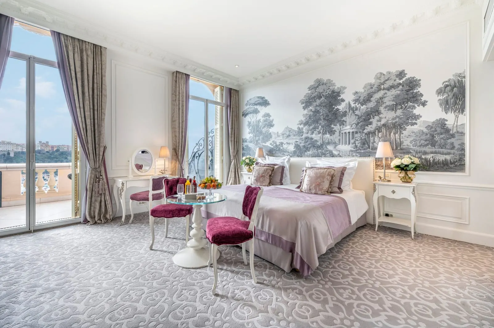 Exclusive Room with sea view and terrace at Hôtel Hermitage Monte-Carlo: the bed, a table for two and French windows to the terrace