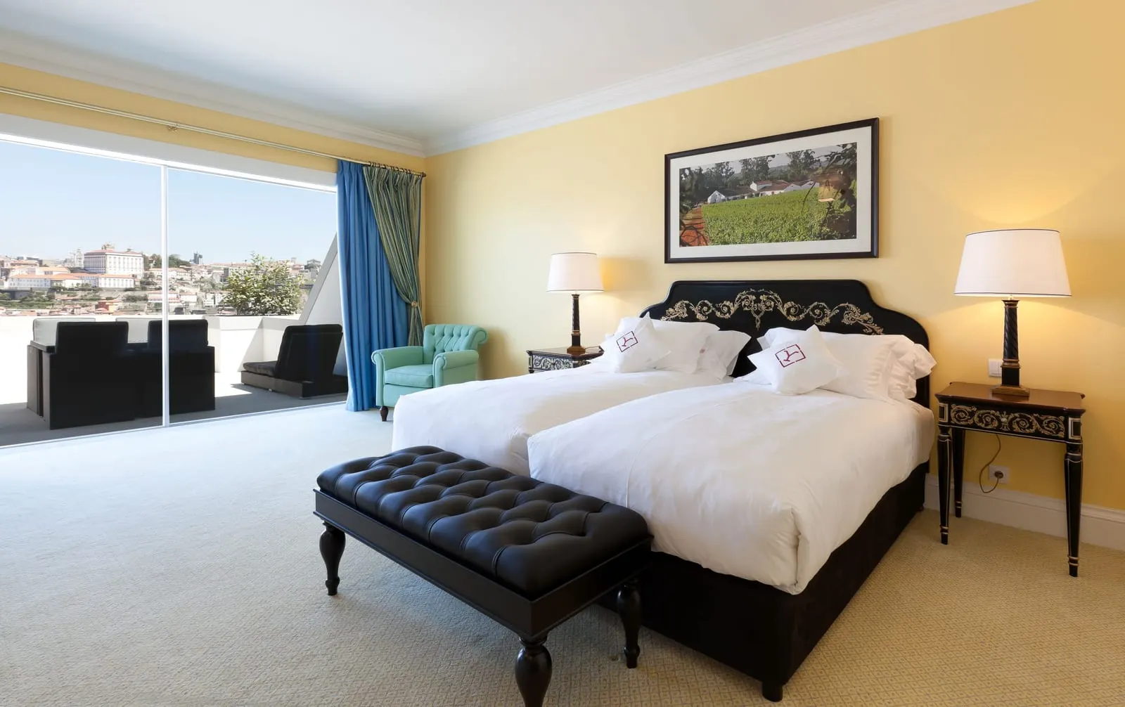 Superior Deluxe Panoramic Room at The Yeatman with twin beds, a leather bench and a glass wall onto the terrace and the city