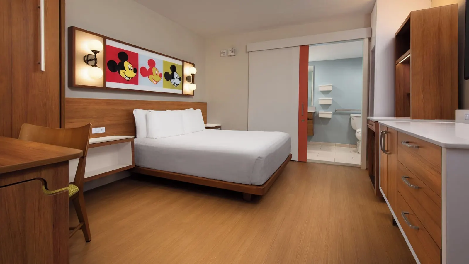 Disney's Pop Century Resort: The queen bed and sliding bathroom door