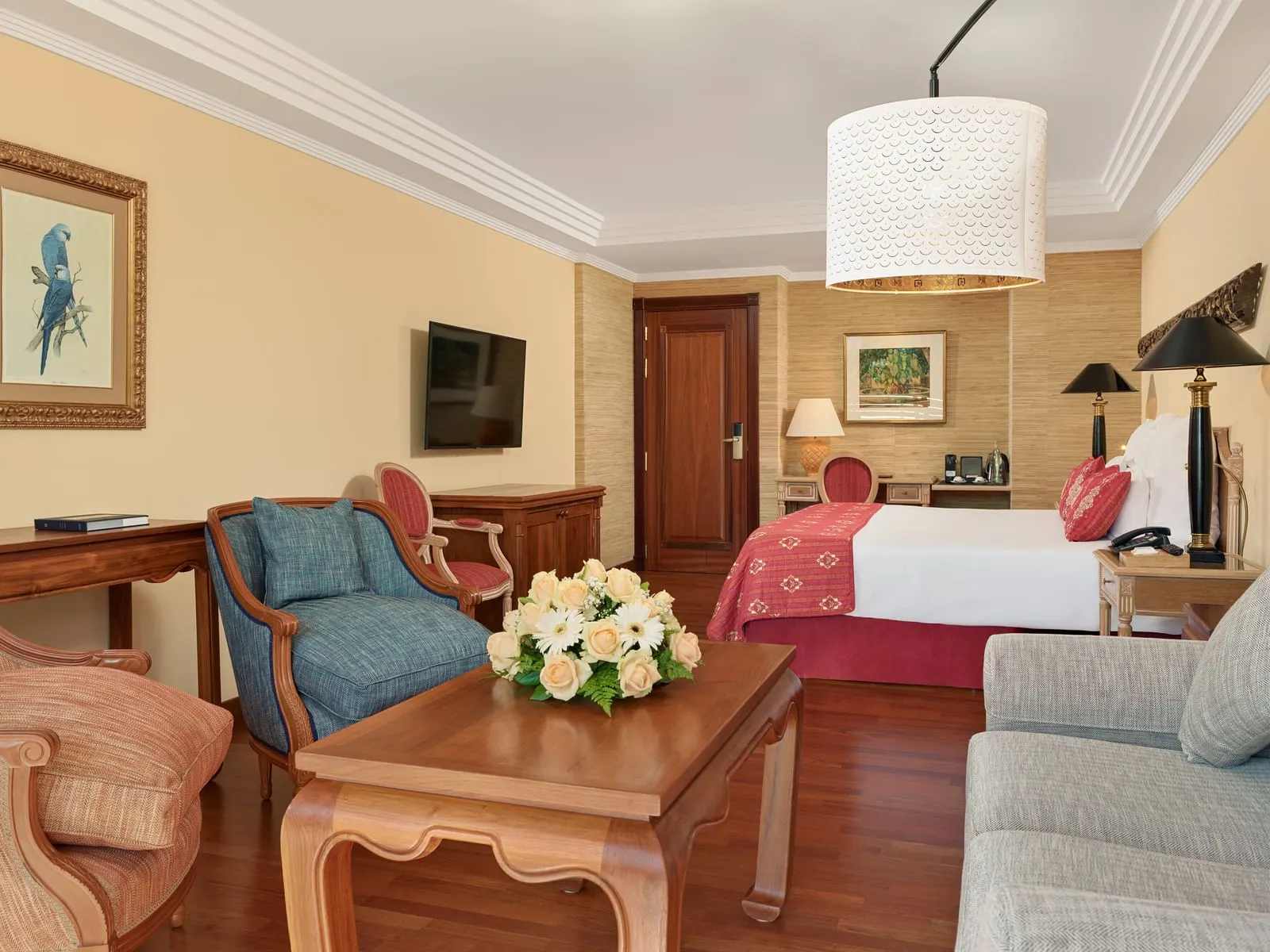 Superior Deluxe Teide View at Hotel Botánico: the sitting area, armchairs and a table in front of the bed