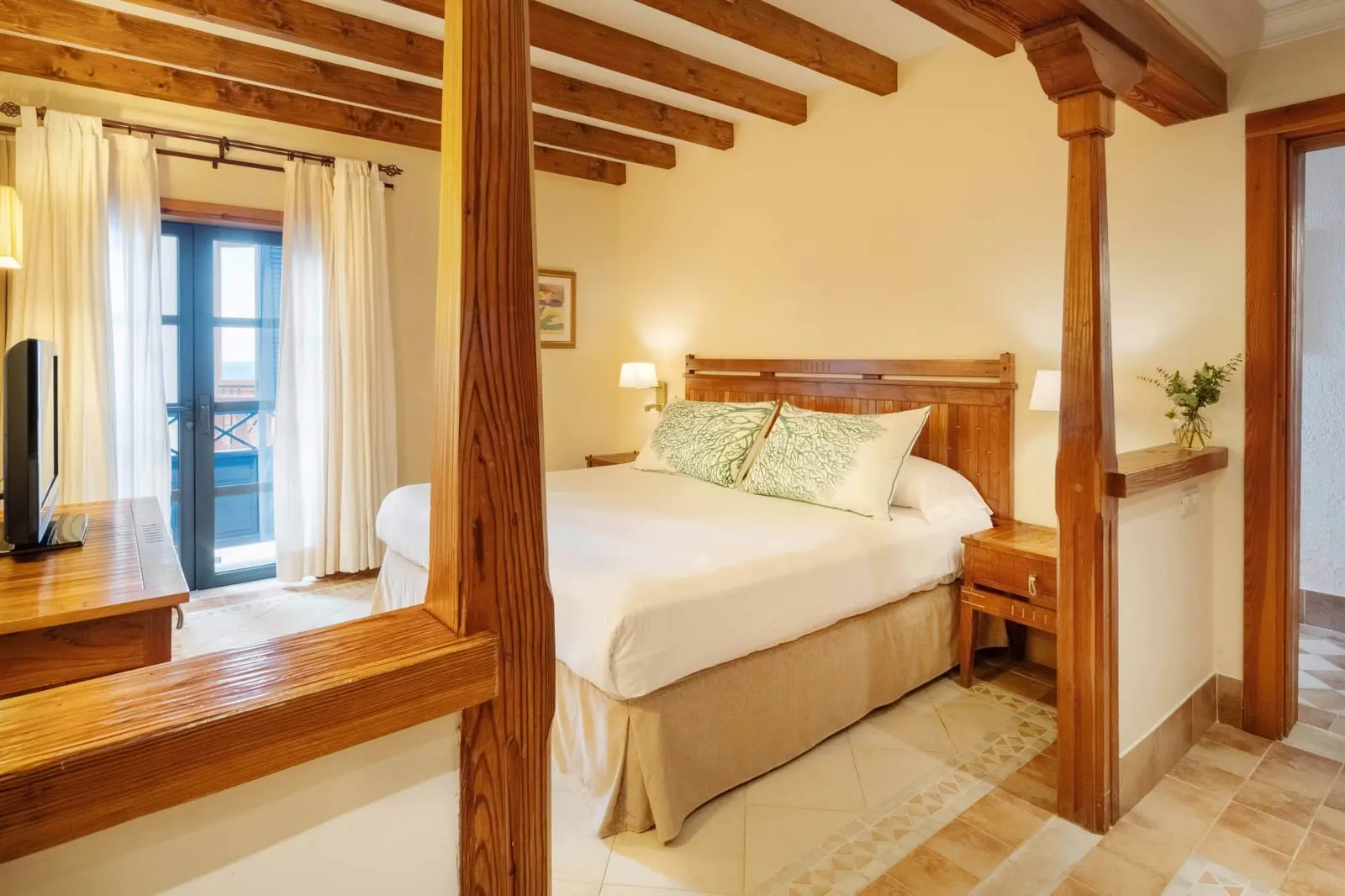 Suite Sea View at Princesa Yaiza Suite Hotel Resort: a double bed in its own bedroom, with glass doors to the terrace