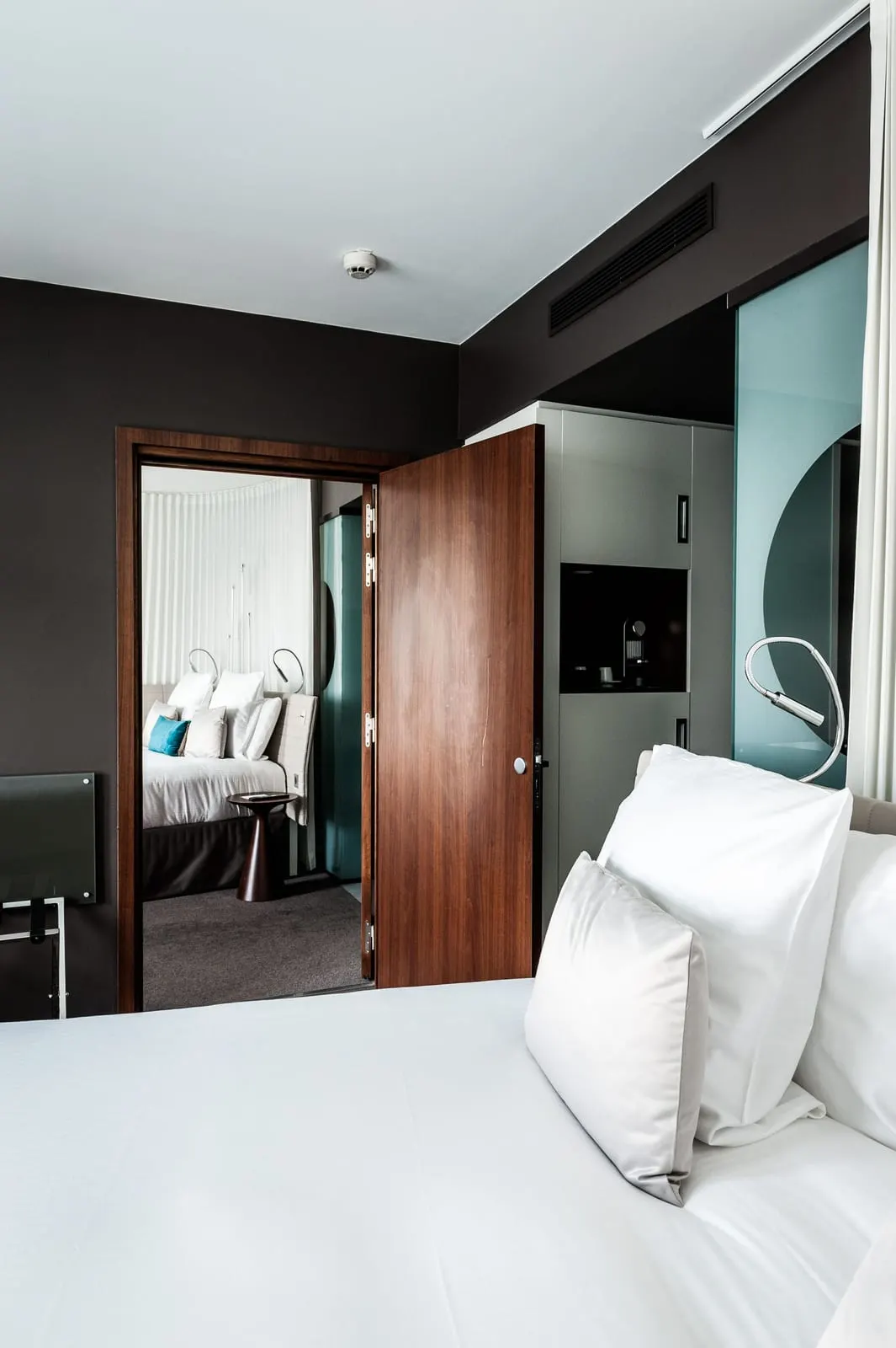Superior Family Room at Hôtel Molitor Paris: an open connecting door from one bedroom through to the second, with its own bed