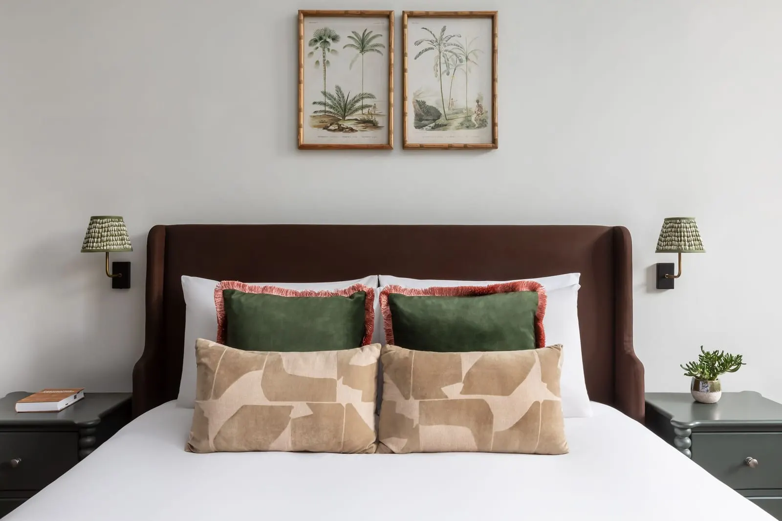 Double Room at Town Hall Hotel: the bed with a brown upholstered headboard, patterned cushions and two framed palm prints