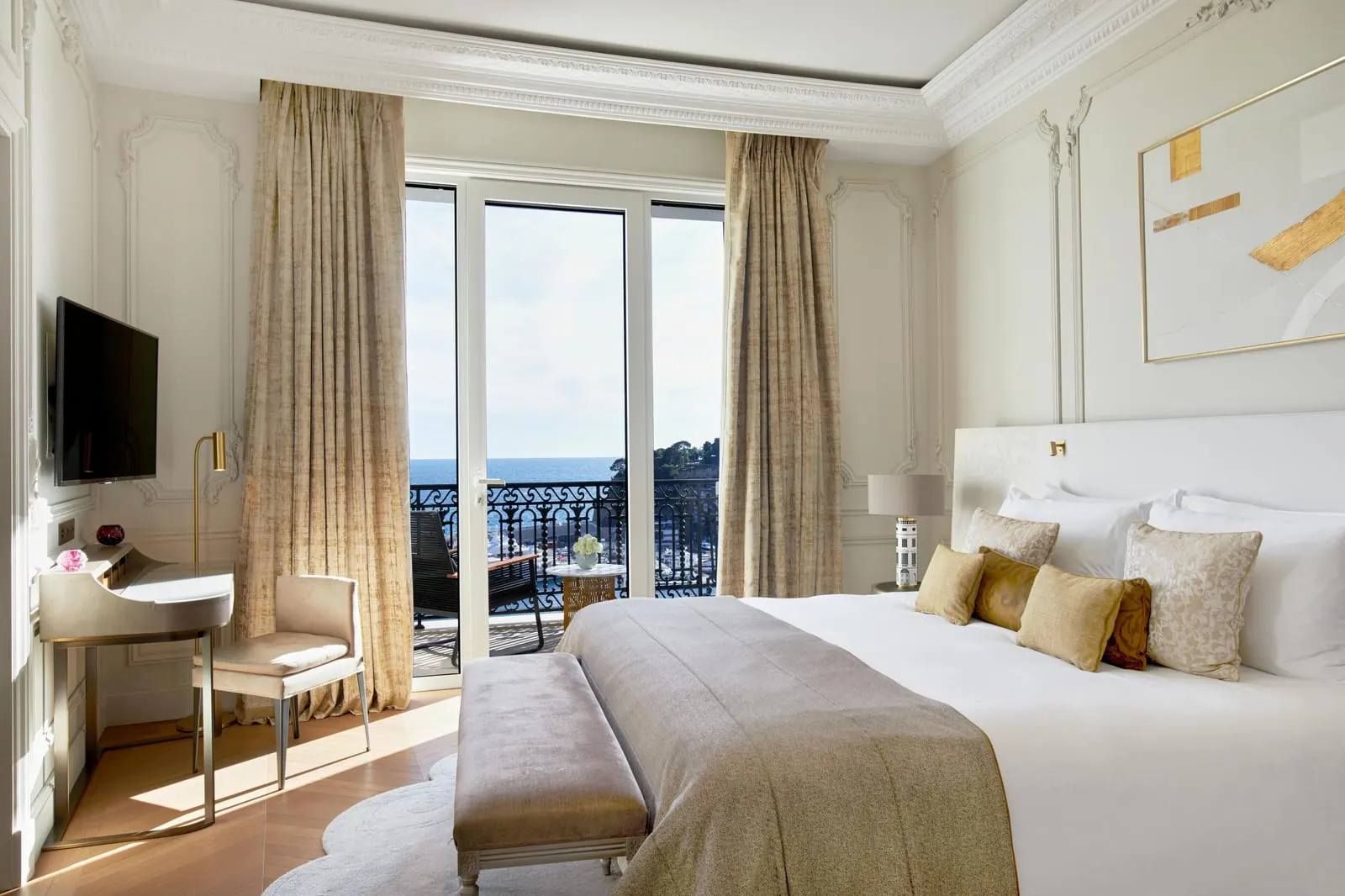 Suite with sea view and terrace at Hôtel de Paris Monte-Carlo: the bedroom, with glass doors to the terrace and the sea