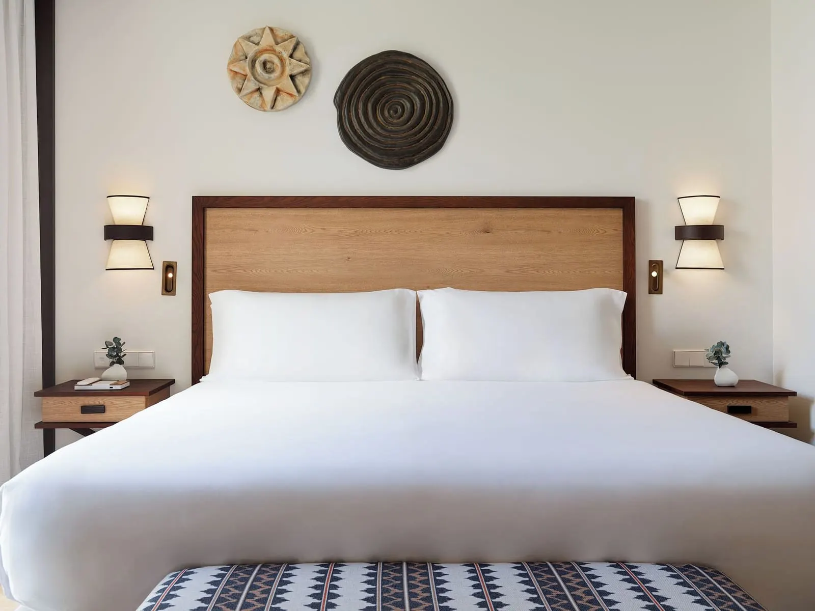 Double Deluxe Room Panoramic View at Gran Hotel Taoro: the bed with a wooden headboard and two wall lights