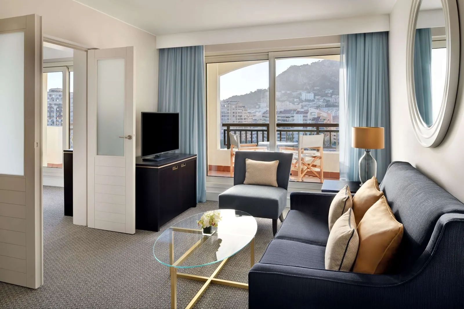 Rose Garden Suite at Columbus Hotel Monte-Carlo: the living room, with glass doors to a terrace over the town