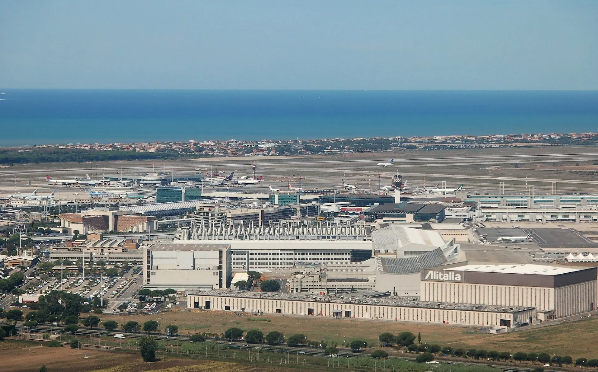 Rome Fiumicino Airport from the air, with the terminals and the sea beyond