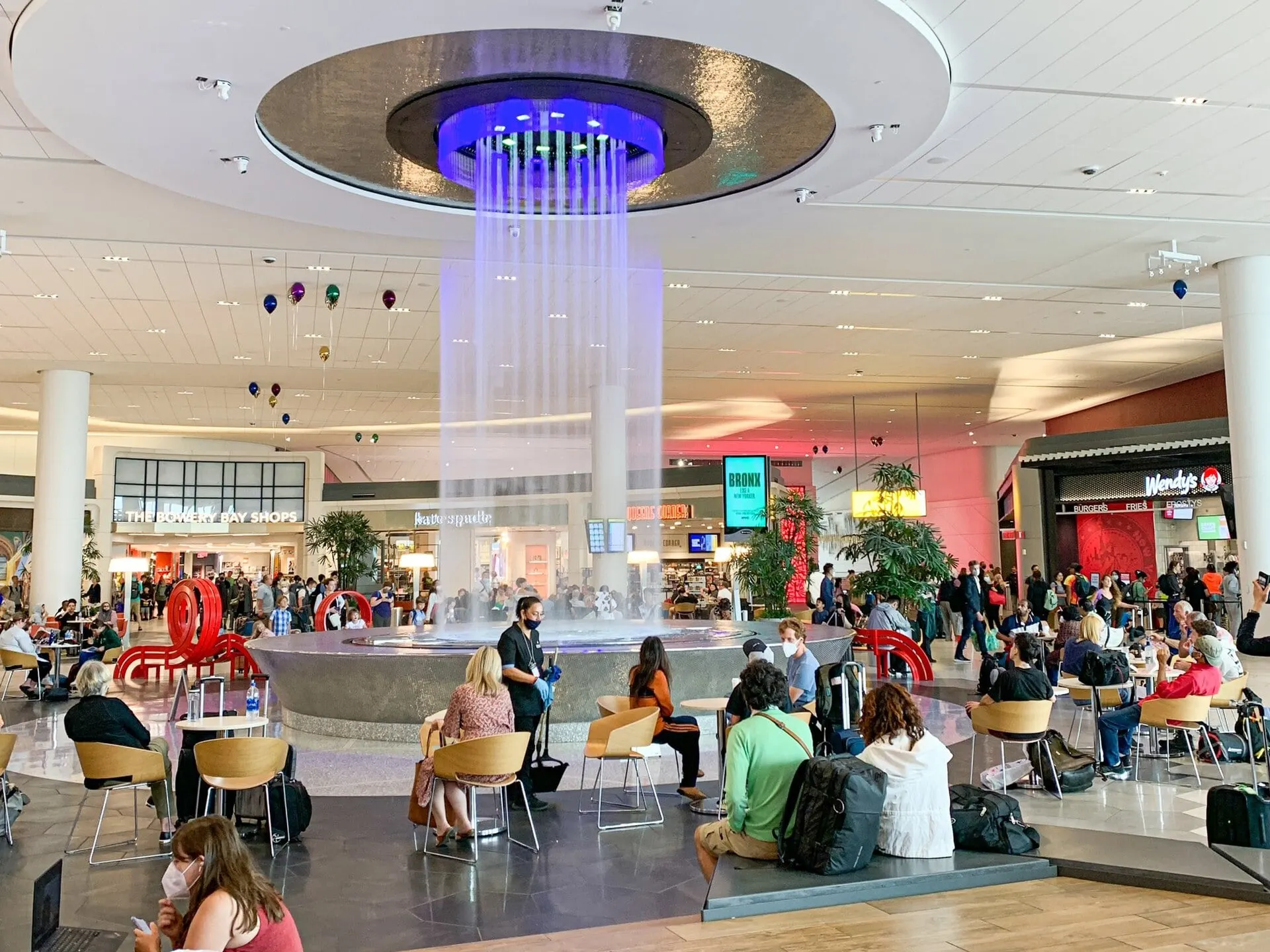 The fountain and seating in the Terminal B concourse after security at LaGuardia