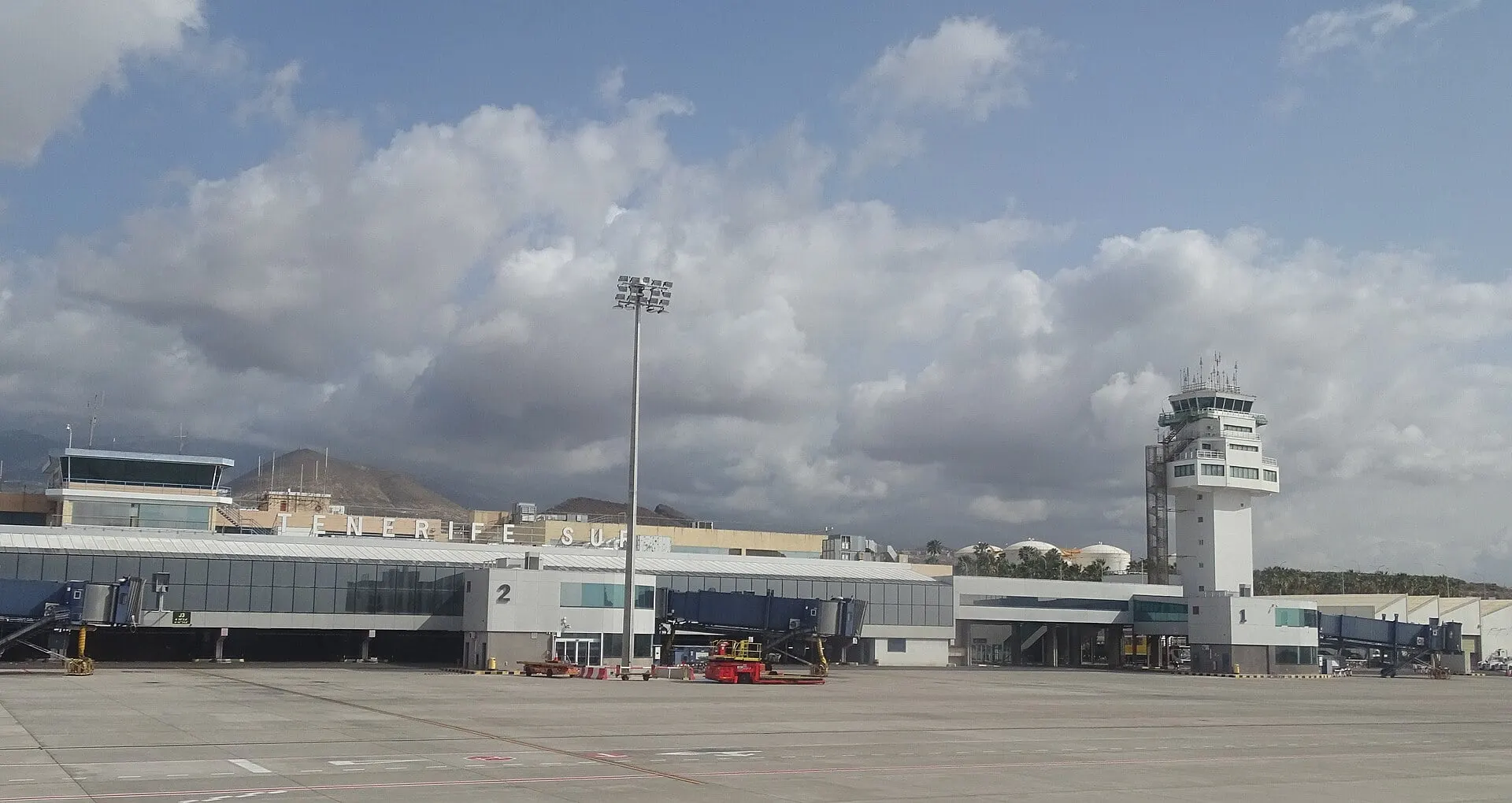 The terminal and control tower at Tenerife South Airport, seen from the apron