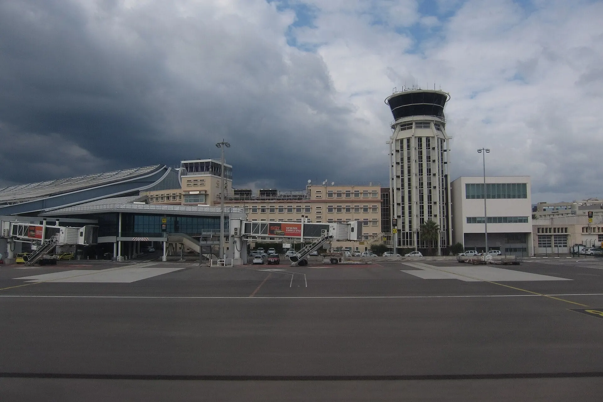 Terminal 1 and the control tower at Nice Côte d'Azur Airport, seen across the apron