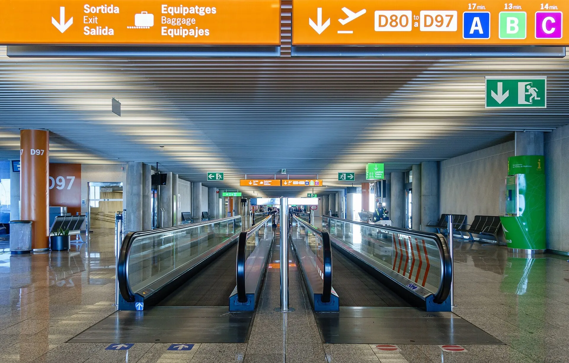 Moving walkways in Module D at Palma de Mallorca Airport, signed to gates D80 to D97