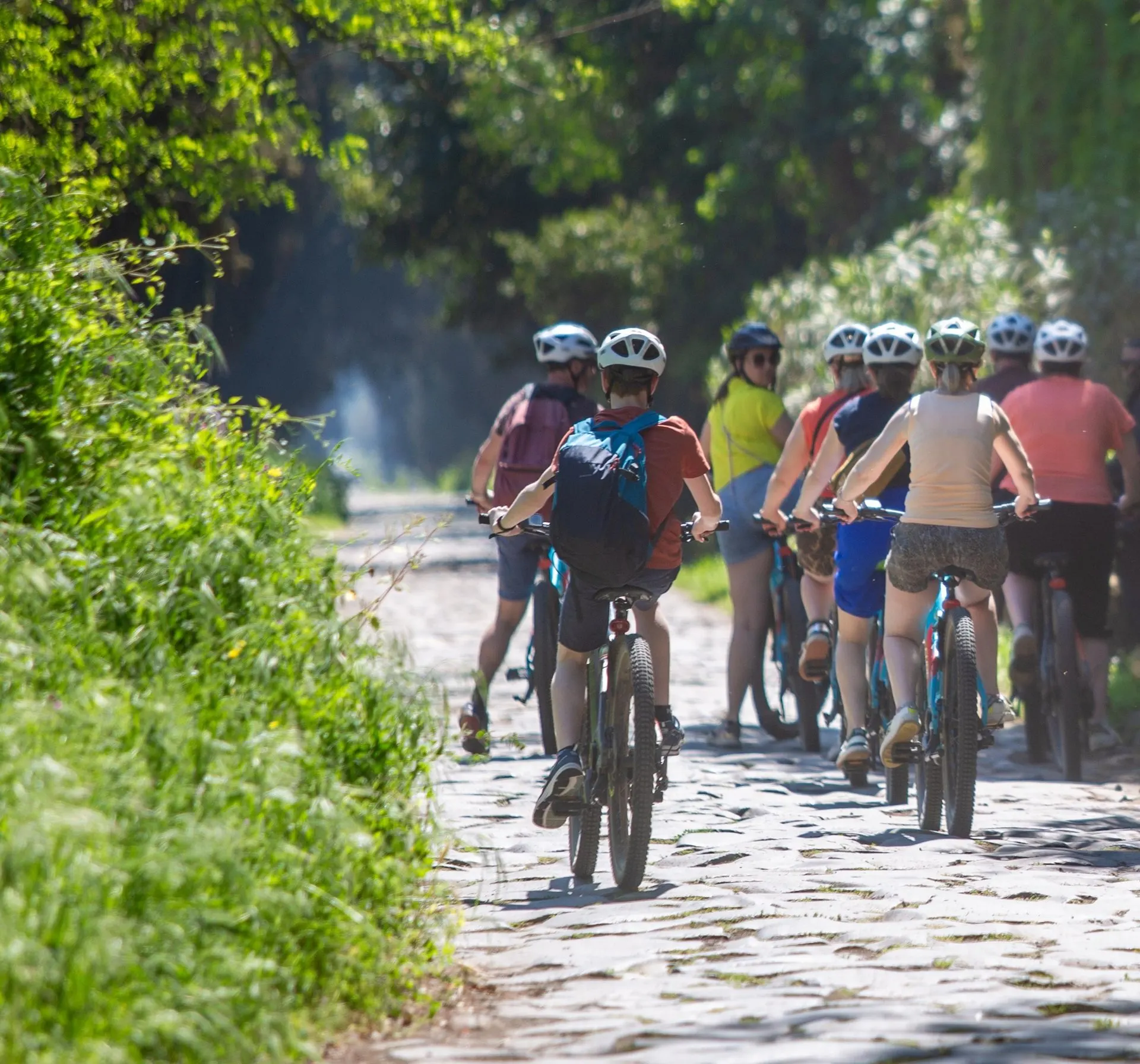 Cyclists on the old Roman paving of the Appian Way