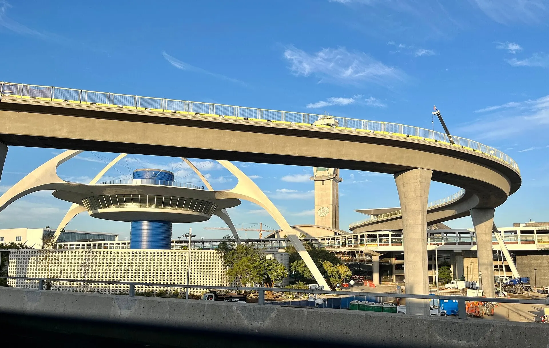 The Theme Building at the heart of LAX, seen from the airport road in July 2023
