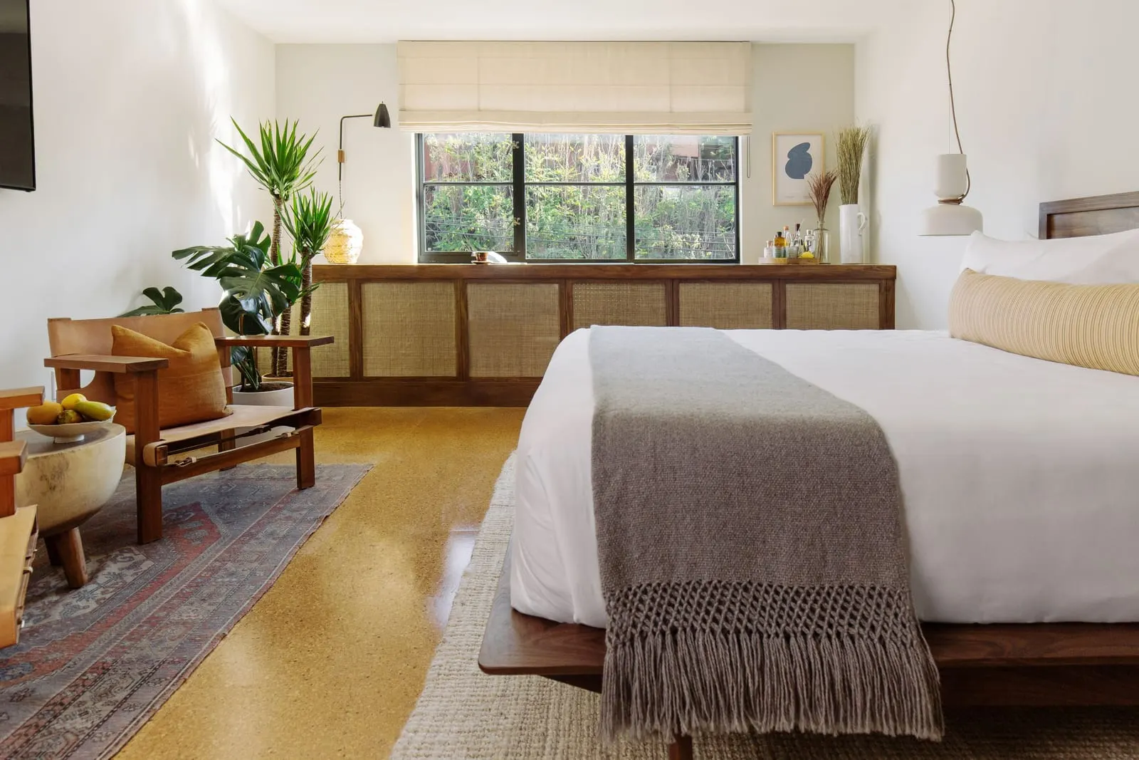 Silver Lake Pool & Inn: A king room with cane cabinetry and a leather chair