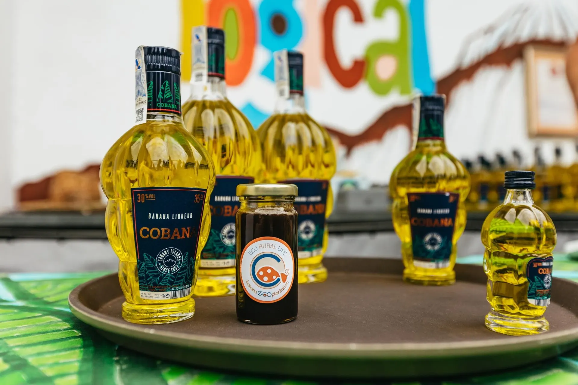 Bottles of banana liqueur on a tray