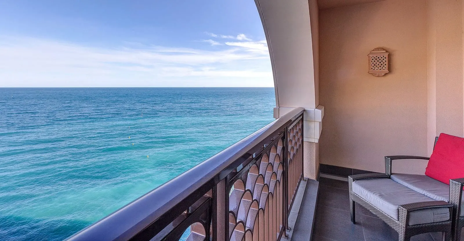 Exclusive Room with sea view at Monte-Carlo Bay Hotel & Resort: a terrace chair by the railing, with the open sea beyond