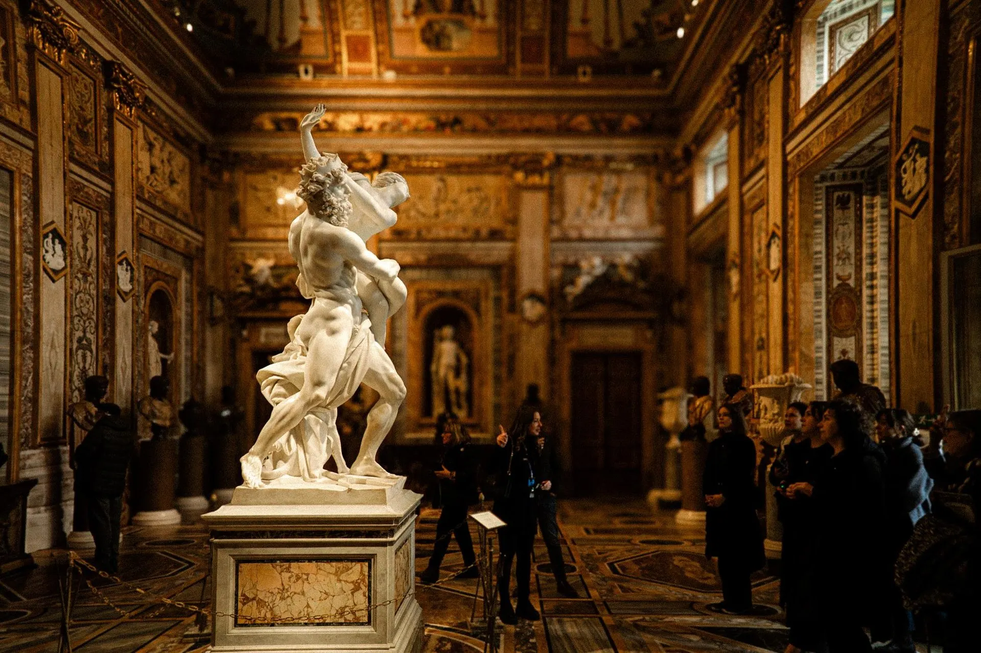 Visitors around Bernini's Apollo and Daphne