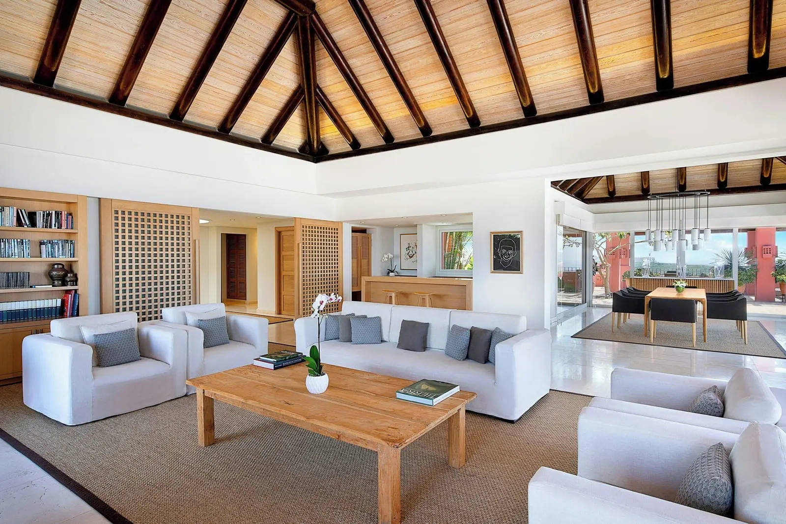 Imperial Suite at the Ritz-Carlton Abama: the living room under a pitched timber roof, a dining table beyond