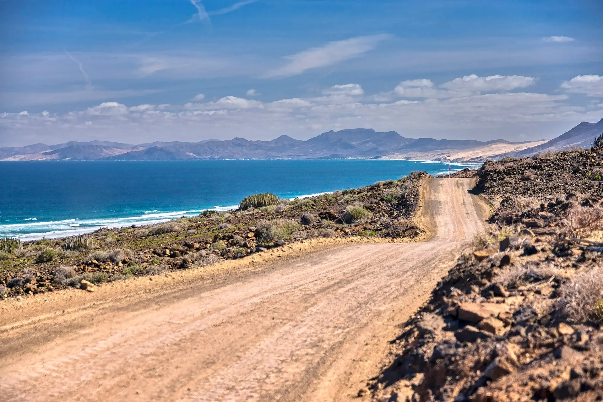 The gravel track to Cofete winding along the hillside above the Atlantic