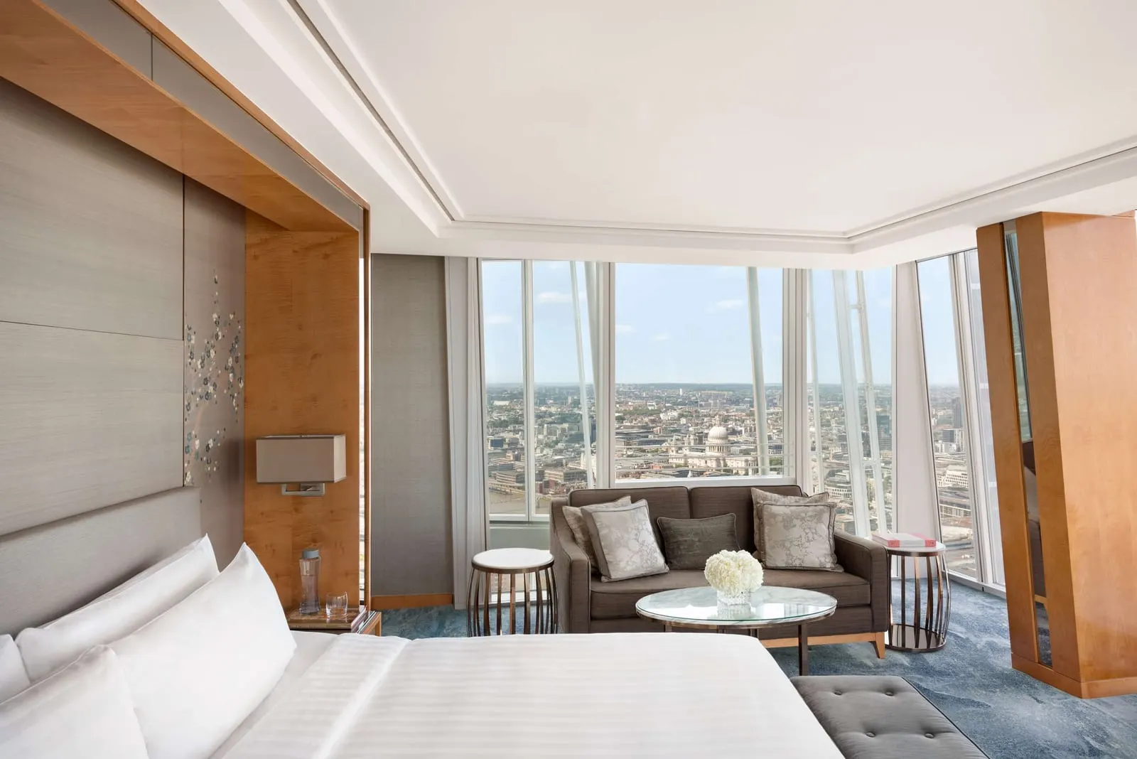 Iconic City View Room at Shangri-La The Shard: the bed, a sofa and floor-to-ceiling corner windows over the city