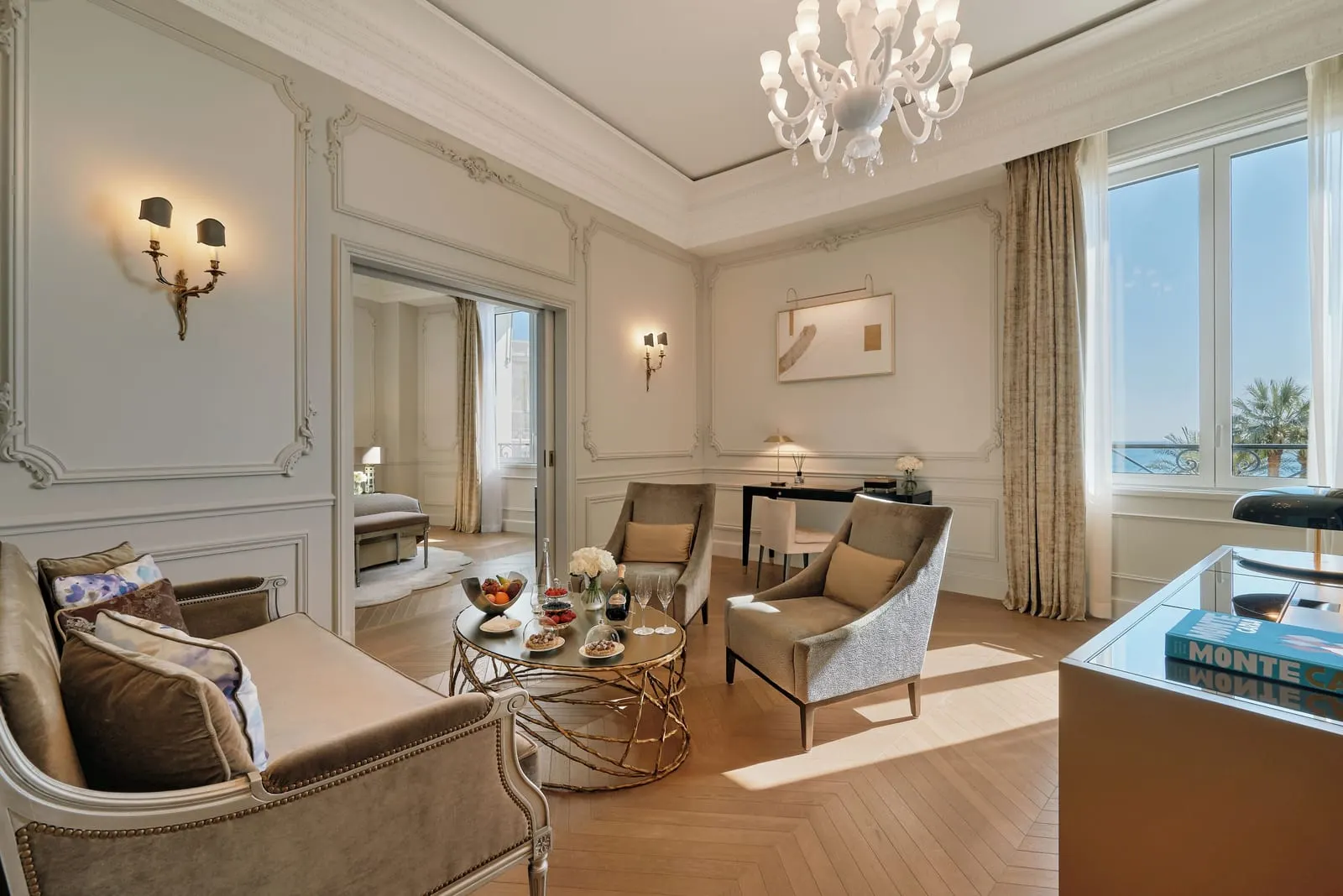 Suite with sea view at Hôtel de Paris Monte-Carlo: the sitting room with a sofa, two armchairs and a window to the sea