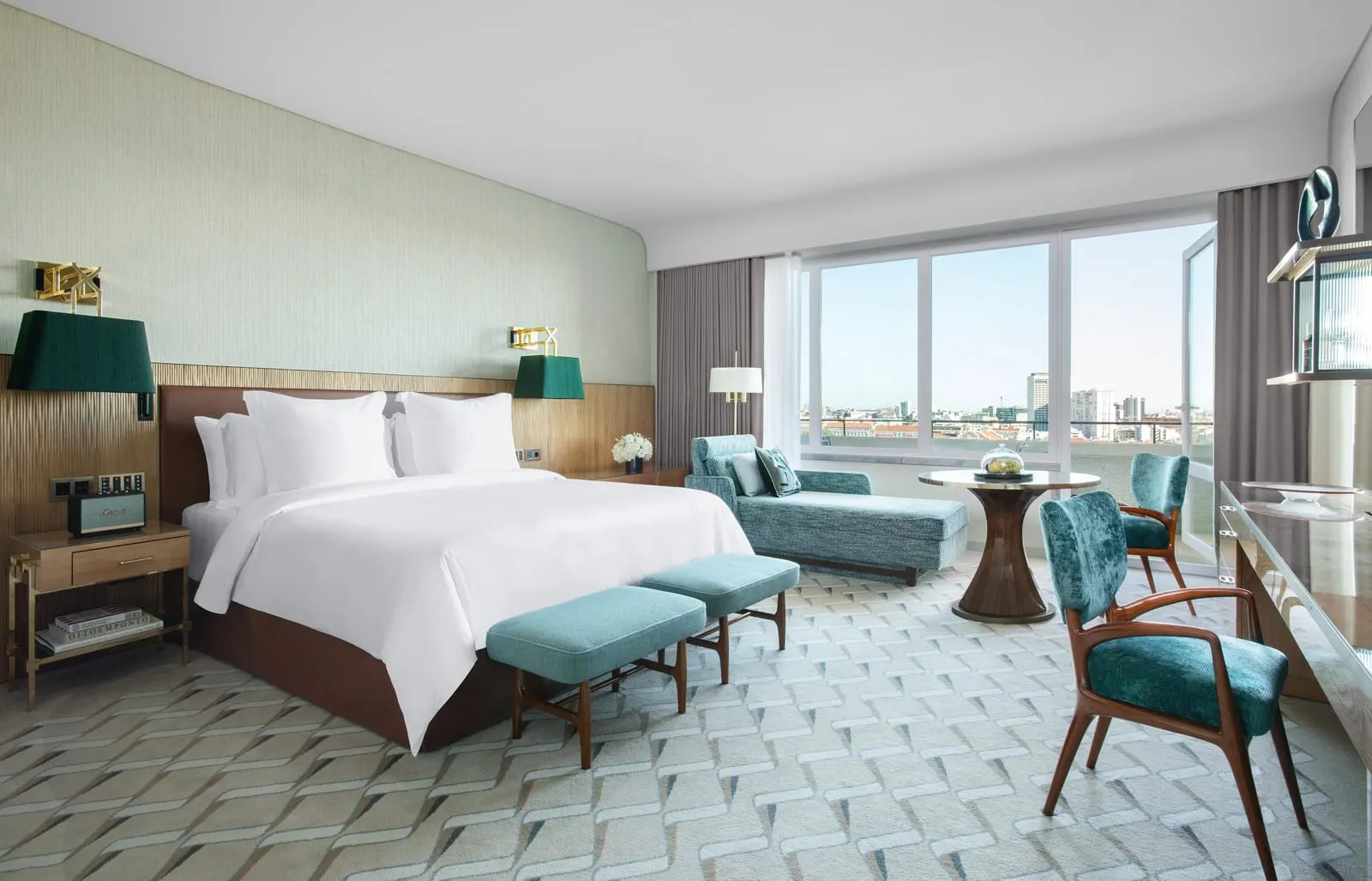 Grand Premier Park-View Room at Four Seasons Ritz Lisbon: the bed with two teal benches, a daybed and a wide window