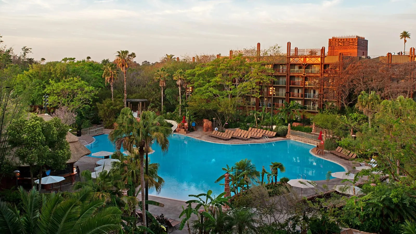 Disney's Animal Kingdom Lodge: Uzima Springs Pool among palms below the lodge