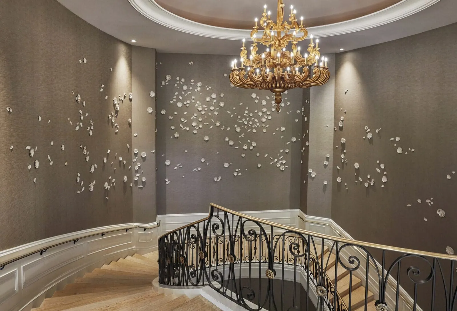 Four Seasons Hotel Las Vegas: The curving staircase beneath a gold chandelier